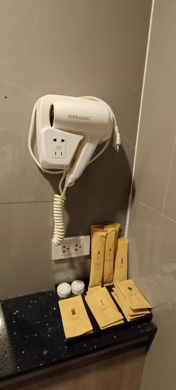 The Airport Courtyard Suvarnabhumi Airport Bangkok Zewnętrze zdjęcie A hair dryer in a hotel bathroom